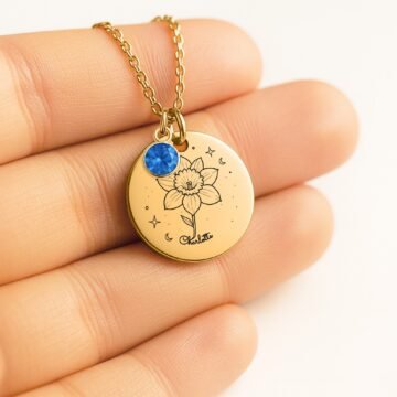 Close-up of December carnation necklace with personalized name engraving and December birthstone charm