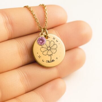 Close-up of October carnation necklace with personalized name engraving and October birthstone charm