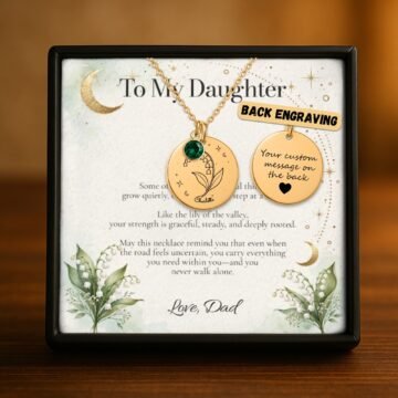 Lily-of-the-valley necklace showing optional personalized engraving on the back