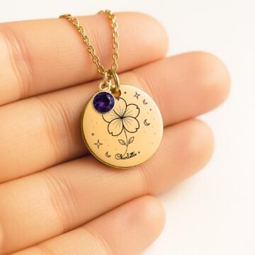 Personalized violet pendant necklace shown in hand for scale