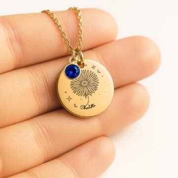 Close-up of september carnation necklace with personalized name engraving and september birthstone charm